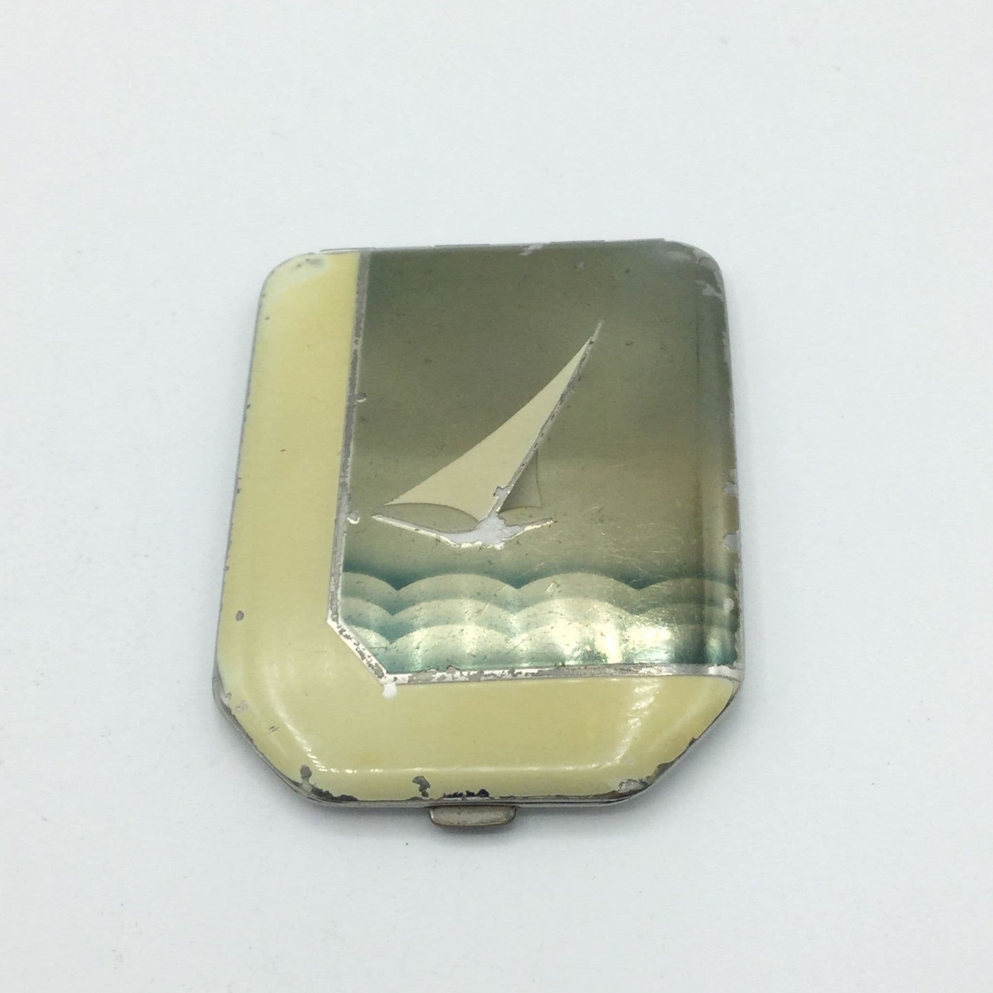 Art Deco 1930s compact showing an enamel of a boat on sea 